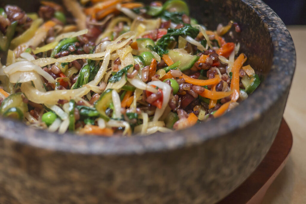A photo of a bibimbap in a dol sot hot stone bowl at Bimbimbap Soho, London