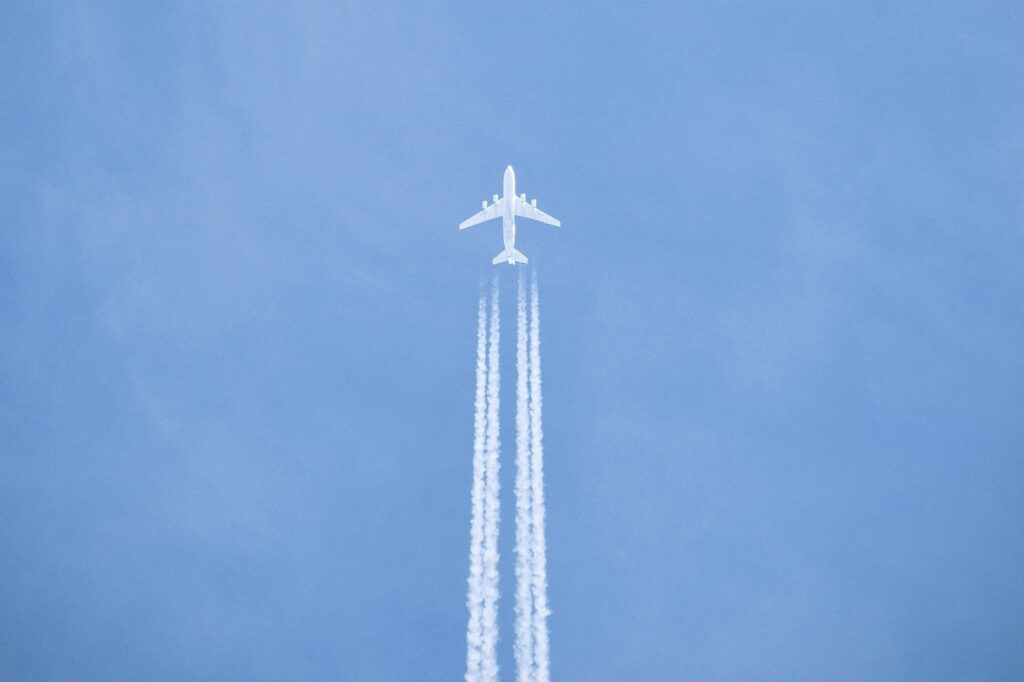 Photo of a plane against a blue sky