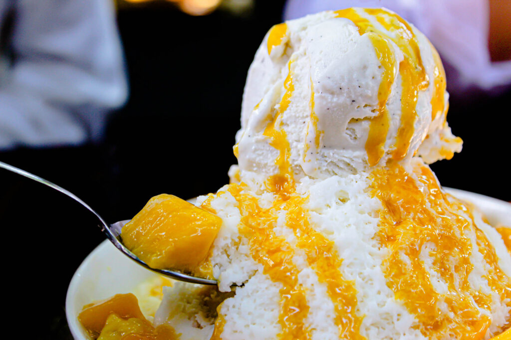A photo of a bowl of mango bingsu, a Korean dessert