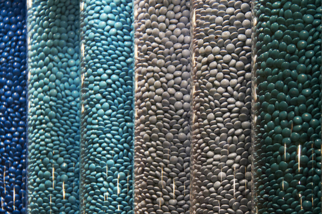 Large tubes of different coloured M&M sweets at the M&M's store in Leicester Square, London