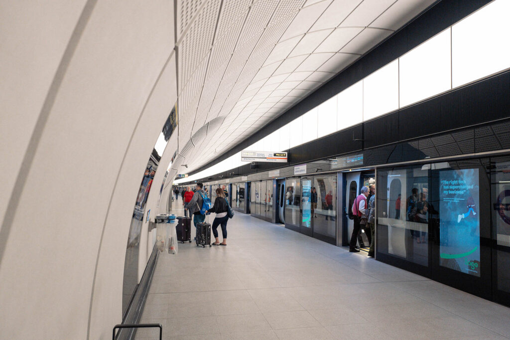Photo of an Elizabeth line station in London with people boarding a train
